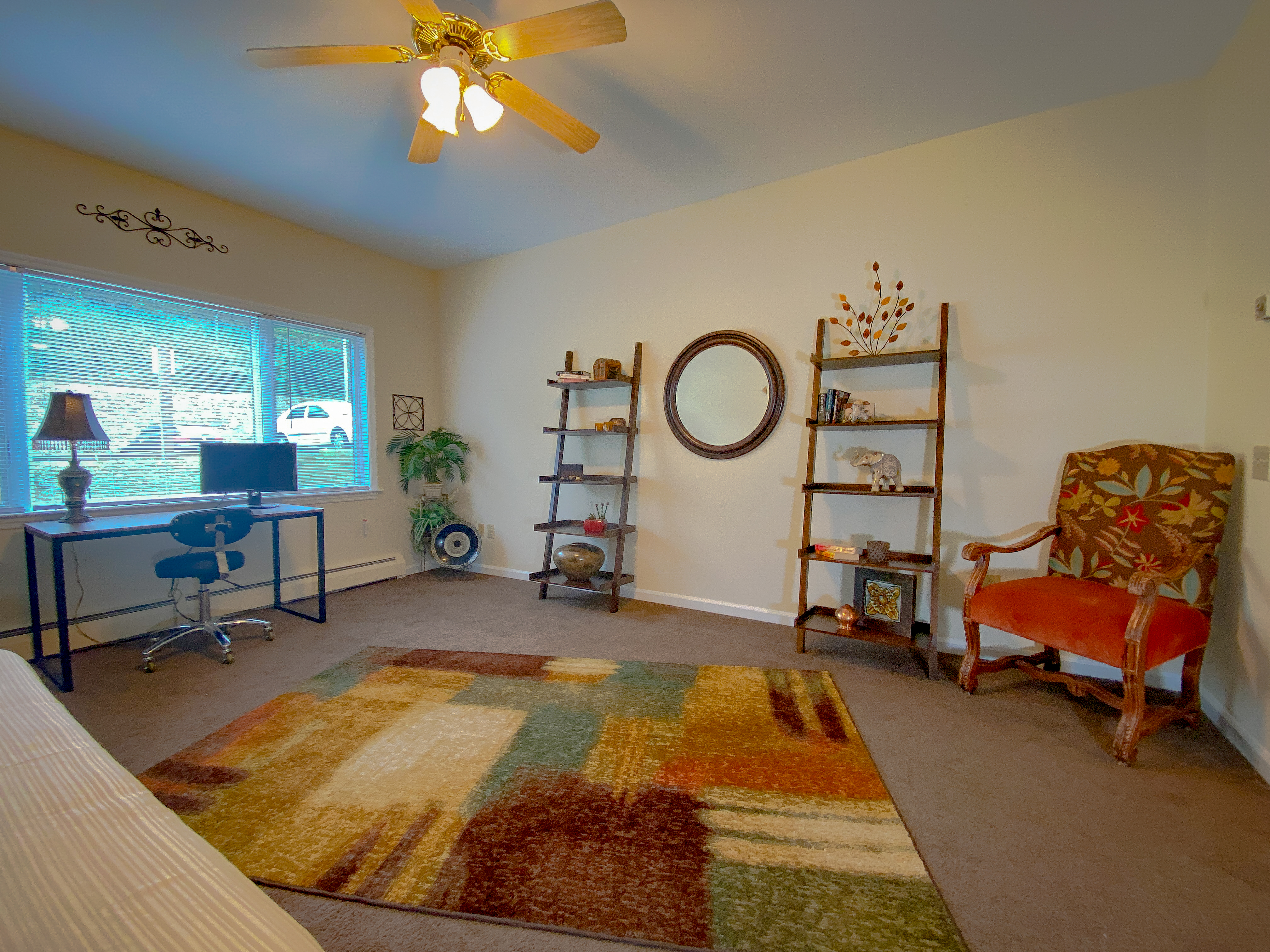Studio sitting area with shelving and warm natural light